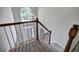 Staircase leading to the entry and features natural wood handrail and white posts at 863 Fairlong Nw Way, Acworth, GA 30101