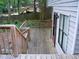 Wooden back deck offers an outdoor space for relaxing and entertaining, and entrance to the house at 219 Park Avenue, Woodstock, GA 30188
