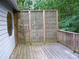 Wooden back deck offers an outdoor space for relaxing and entertaining, with a lattice privacy screen at 219 Park Avenue, Woodstock, GA 30188
