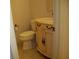 Powder room featuring a unique vanity with decorative hardware and a tiled floor at 219 Park Avenue, Woodstock, GA 30188