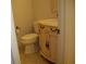 This half bathroom showcases a vintage-style vanity with a sink and toilet at 219 Park Avenue, Woodstock, GA 30188