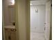 A view into a bathroom with a vanity, ornate cabinet, and a stylish sink and faucet at 219 Park Avenue, Woodstock, GA 30188