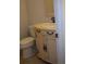 This half bathroom features a classic vanity with curved drawers and a decorative mirror at 219 Park Avenue, Woodstock, GA 30188