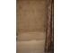 This bathtub has tan tile surround and a decorative shower curtain at 219 Park Avenue, Woodstock, GA 30188