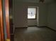 A bedroom with carpet and a window with a closed shade at 219 Park Avenue, Woodstock, GA 30188