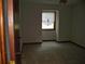 Bedroom with neutral carpet, wood trim and a window covered with pleated blinds at 219 Park Avenue, Woodstock, GA 30188