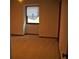 Bedroom with neutral carpet, wood trim and a window covered with pleated blinds at 219 Park Avenue, Woodstock, GA 30188