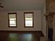 Cozy living room showcasing hardwood floors and stone fireplace at 219 Park Avenue, Woodstock, GA 30188