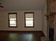 Comfortable living room with a stone fireplace and gleaming hardwood floors at 219 Park Avenue, Woodstock, GA 30188