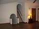 Spacious living room with hardwood floors and an arched entryway to the staircase at 219 Park Avenue, Woodstock, GA 30188