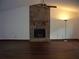 Living room features a stone fireplace, hardwood floors, and ample natural light at 219 Park Avenue, Woodstock, GA 30188