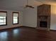 Cozy living room showcasing hardwood floors and stone fireplace at 219 Park Avenue, Woodstock, GA 30188