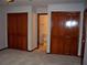 Spacious main bedroom offering an ensuite bathroom and dual closets, perfect for ample storage at 219 Park Avenue, Woodstock, GA 30188