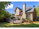 Spacious backyard with a multi-tiered deck for outdoor relaxation and enjoyment of the beautiful greenery at 4729 Woodland Brook Se Ct, Atlanta, GA 30339