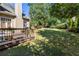 Expansive backyard featuring a well-kept lawn and deck, creating a serene outdoor retreat at 4729 Woodland Brook Se Ct, Atlanta, GA 30339