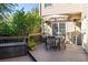 Outdoor deck featuring a dining table, chairs, and heaters, ideal for outdoor dining and entertaining at 4729 Woodland Brook Se Ct, Atlanta, GA 30339