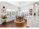 Bright dining area with a round table, unique chairs, and ample natural light at 4729 Woodland Brook Se Ct, Atlanta, GA 30339