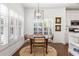 Cozy dining area featuring a round table, stylish chairs, and modern chandelier at 4729 Woodland Brook Se Ct, Atlanta, GA 30339