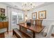 Bright dining room with a wooden table, bench seating, and natural light at 4729 Woodland Brook Se Ct, Atlanta, GA 30339