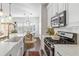 Modern kitchen with stainless steel appliances, white cabinetry, and a functional layout at 4729 Woodland Brook Se Ct, Atlanta, GA 30339