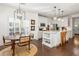 Open-concept kitchen and dining area with modern appliances and stylish lighting at 4729 Woodland Brook Se Ct, Atlanta, GA 30339