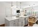 Spacious kitchen featuring modern appliances, an island sink, and access to living spaces at 4729 Woodland Brook Se Ct, Atlanta, GA 30339