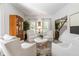 Well-lit living room with neutral decor, hardwood floors, and large windows at 4729 Woodland Brook Se Ct, Atlanta, GA 30339