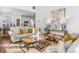 Sun-drenched living room featuring a comfortable sofa and stylish decor at 4729 Woodland Brook Se Ct, Atlanta, GA 30339