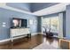Main bedroom offers natural light, wooden floors, and a designated workout area at 4729 Woodland Brook Se Ct, Atlanta, GA 30339