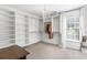 Spacious walk-in closet with custom shelving, drawers, hanging racks and a chandelier at 4729 Woodland Brook Se Ct, Atlanta, GA 30339