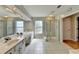 Bathroom featuring double sinks, shower and large mirror at 148 Crystal Downs Way, Suwanee, GA 30024