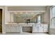 Bright bathroom featuring a double vanity, spacious mirror, and recessed lighting at 148 Crystal Downs Way, Suwanee, GA 30024