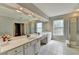 Bathroom featuring double sinks, shower and large mirror at 148 Crystal Downs Way, Suwanee, GA 30024