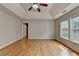 Spacious bedroom with hardwood floors, ceiling fan, and natural light at 148 Crystal Downs Way, Suwanee, GA 30024
