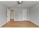A bedroom showcases hardwood floors, two doors and light-colored walls at 148 Crystal Downs Way, Suwanee, GA 30024