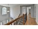 A second floor hallway showcases hardwood floors at 148 Crystal Downs Way, Suwanee, GA 30024