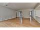 Spacious living room featuring gleaming hardwood floors and neutral paint, creating a welcoming atmosphere at 148 Crystal Downs Way, Suwanee, GA 30024