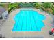 Large community pool with lounge chairs and mature landscaping, perfect for relaxing and enjoying the outdoors at 148 Crystal Downs Way, Suwanee, GA 30024