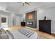 An elegant main bedroom featuring a cozy fireplace, light-colored walls, and light hardwood floors at 270 Boulder Dr, Roswell, GA 30075