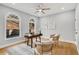 Bright office featuring arched windows, hardwood floors, and neutral decor at 270 Boulder Dr, Roswell, GA 30075