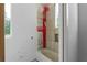 Bathroom featuring newly tiled walls, a bathtub, and a bright window with natural light at 5210 Brownlee Rd, Stone Mountain, GA 30087
