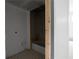 Bathroom showcasing an alcove tub and decorative tile flooring amid ongoing construction at 5210 Brownlee Rd, Stone Mountain, GA 30087