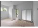 Bright bedroom featuring a sliding glass door to a balcony and a large window for natural light at 5210 Brownlee Rd, Stone Mountain, GA 30087