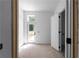 Welcoming entryway with a glass door providing ample natural light and access to the outdoors at 5210 Brownlee Rd, Stone Mountain, GA 30087