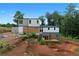 Two-story home under construction showing the back with a foundation and unfinished project, ready to be completed at 5210 Brownlee Rd, Stone Mountain, GA 30087