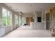 Spacious living room with drywall and large windows overlooking greenery, ready for customization at 5210 Brownlee Rd, Stone Mountain, GA 30087