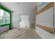 Open living room featuring light wall color, with exposed wall framing with decorative wood design at 5210 Brownlee Rd, Stone Mountain, GA 30087