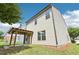 The home's backyard features a wooden pergola and a lush green space at 72 Fern Walk, Lawrenceville, GA 30045