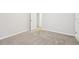 Neutral bedroom with a carpeted floor and doorway to an adjacent room at 72 Fern Walk, Lawrenceville, GA 30045