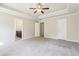 Neutral bedroom with carpet, ceiling fan, and doors to bathroom and closet; bright and modern at 72 Fern Walk, Lawrenceville, GA 30045